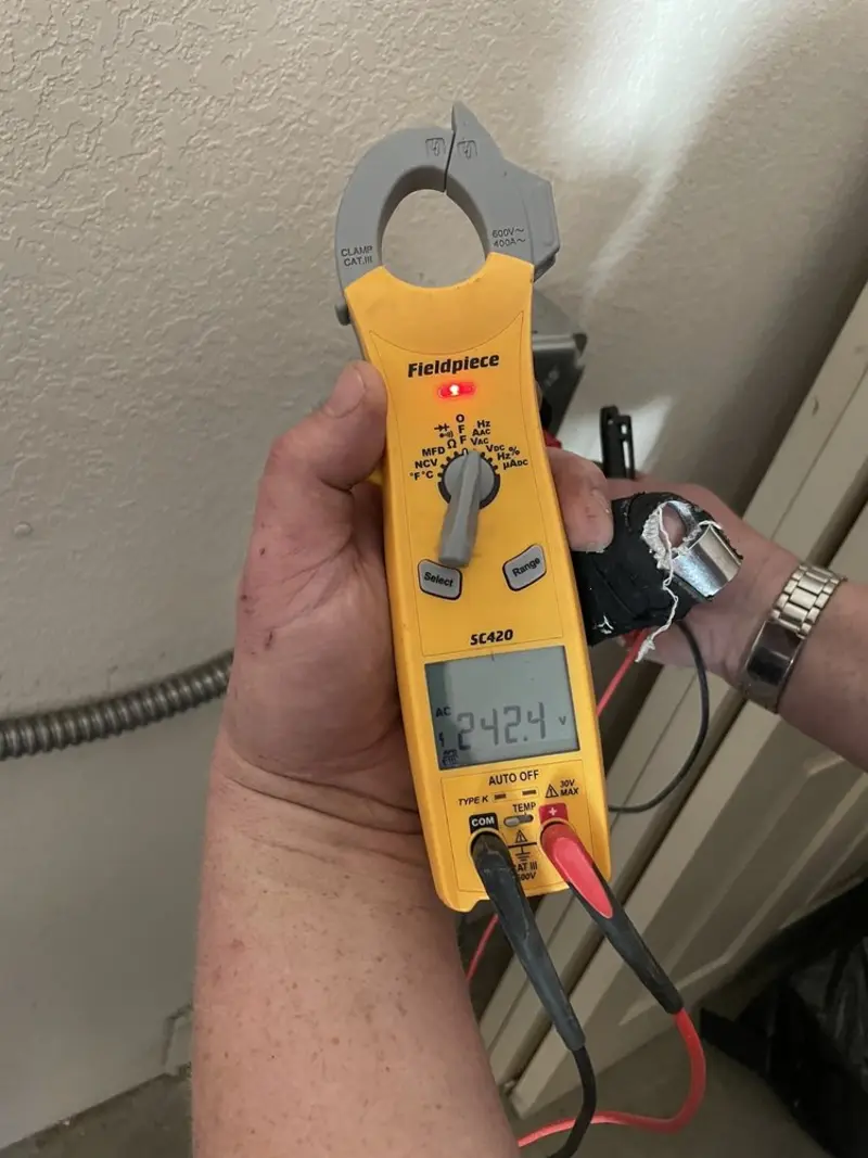 Voltage testing with clamp meter during Electrical Installation Services in Trenton